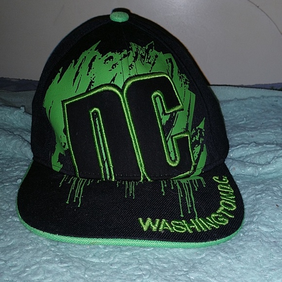 green and black dc hat